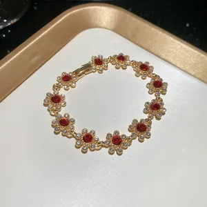 Vintage floral gold-plated chain bracelet with sparkling red and white rhinestone crystals