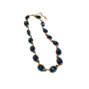 Vintage gold-toned necklace with oval deep blue crystal stones and adjustable chain