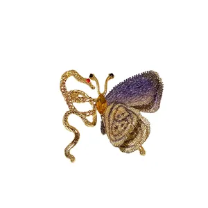Vintage butterfly and snake brooch with purple knitted wings and yellow crystal center