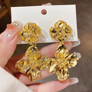 Elegant large gold-toned floral earrings with vintage textured finish and silver post