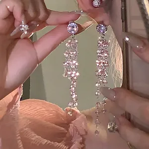 Elegant pink rhinestone dangling tassel earrings with sparkling teardrop details