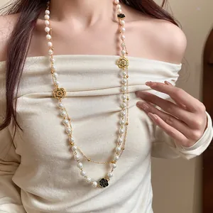 Detailed view of a vintage French-style double-layer necklace with pearls and flowers.