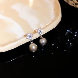 Elegant zircon flower earrings with grey pearl drop charms on silver needle posts
