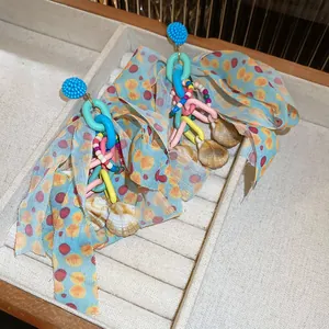 Handmade Dopamine style colorful shell beaded earrings with vibrant fabric ribbons