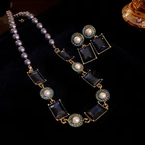 French vintage pearl necklace and earrings set with dark blue rectangular crystals