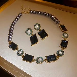 French retro palace style necklace and earring set with grey pearls and blue crystals