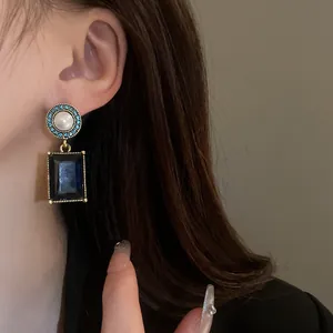 Vintage French court style earrings with pearl and dark blue rectangular gemstone