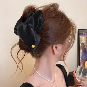 Elegant Korean style black fabric bow hair claw clip for women's graceful updo hairstyles