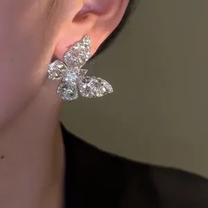 Elegant silver needle butterfly stud earring adorned with sparkling zircon crystals