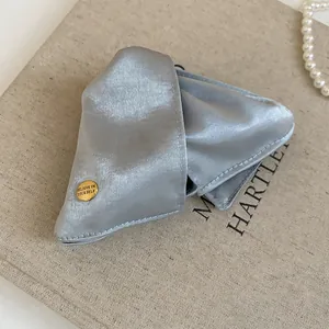 Elegant silver triangle fabric hair claw clip with golden believe in yourself button