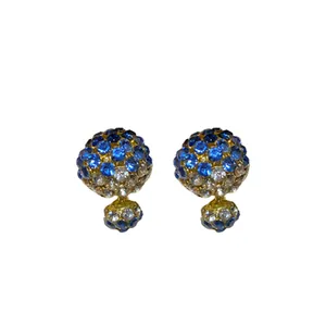Elegant gold-tone double-sided stud earrings with blue and white crystal rhinestones
