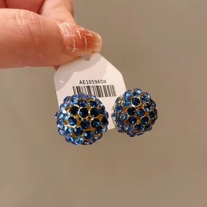 Detailed view of fashionable blue rhinestone sphere stud earrings on product card