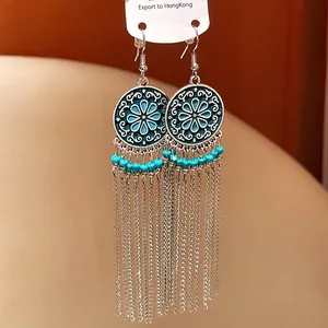 Bohemian retro metal tassel earrings with turquoise beads and engraved floral discs