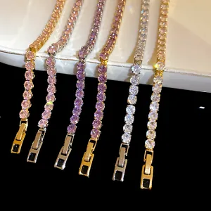 Close-up detail of 18k gold plated cubic zirconia bracelets with square buckle clasp