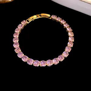 Detailed view of 18k gold plated bracelet with sparkling pink cubic zirconia.