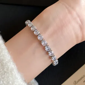 Detail view of a luxury 18k gold plated bracelet featuring square cut sparkling zircons