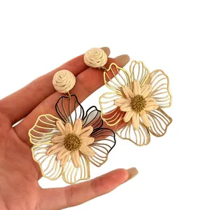 Large hollow metal flower earrings with woven raffia center, stylish and lightweight