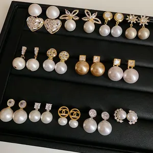 Detailed view of French retro pearl earrings collection in various elegant styles
