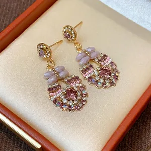 Exquisite silver needle earrings with pink crystals and butterfly accents in a luxury box