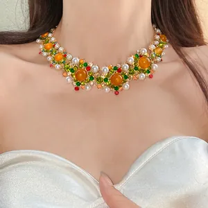 Macro view of a luxury vintage court style necklace with colorful pearls and rhinestones