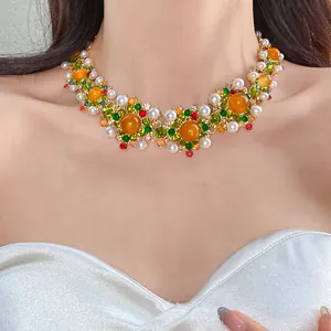 Detailed close-up of a vintage palace style necklace with colorful rhinestones and pearls