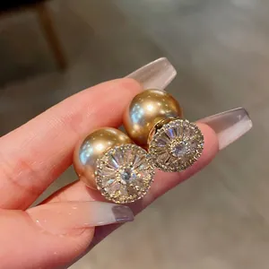 Elegant gold-plated zircon pearl earrings with double-bead design on silver needles.