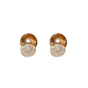 Elegant gold-plated stud earrings with sparkling zircon and champagne pearl back design