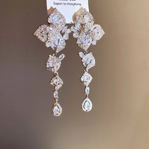Sparkling leaf-shaped tassel earrings with heavy-duty zircon stones, elegant luxury style.