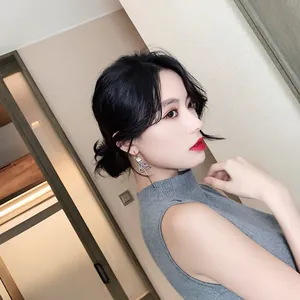 Elegant Chinese style asymmetric long tassel earrings shown worn by an Asian model