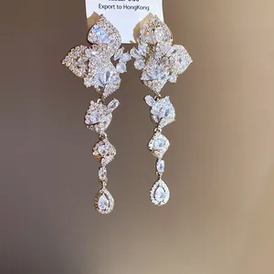Detail of sparkling zircon leaf tassel earrings with intricate craftsmanship