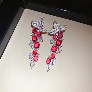Elegant red oval stone earrings with sparkling zircon leaf-shaped tassel details