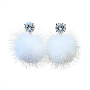 Elegant white faux fur pom-pom stud earrings with brilliant cubic zirconia accents