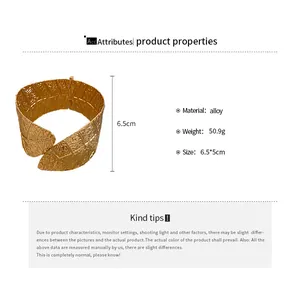 Detail view of gold leaf textured cuff bracelet with size and material specifications