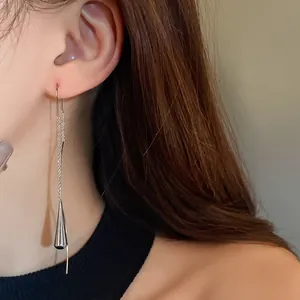 Elegant minimalist silver-toned metal drop tassel earrings featuring a geometric ear thread design