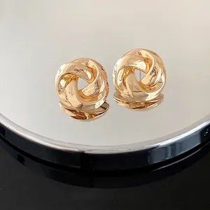 French vintage style gold twisted rose stud earrings with minimalist elegant design