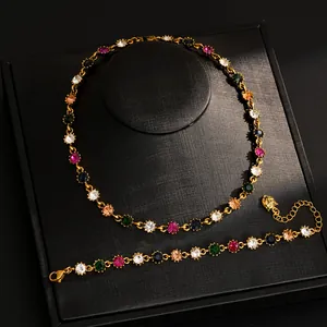 Macro view of multi-colored rhinestone necklace and bracelet set on premium black box