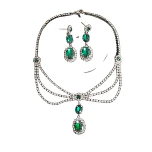 Elegant vintage emerald green teardrop necklace and earrings set with sparkling rhinestones