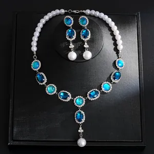 Exquisite detailed view of vintage jewelry set with blue rhinestones and white pearls