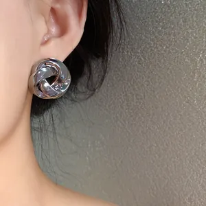 Elegant silver-tone twisted rose metal stud earrings in French vintage minimalist style