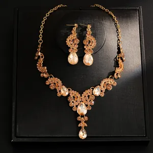 Detailed close-up shot of a luxury champagne rhinestone necklace and earring set