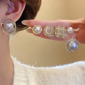 Elegant silver needle geometric pearl earrings set with sparkling tiny rhinestones
