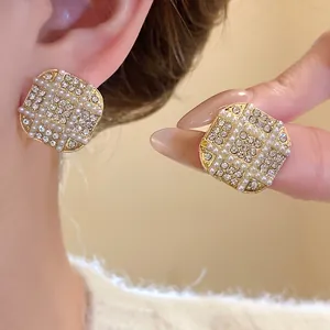Elegant French vintage geometric stud earrings with pearls and crystals for women.