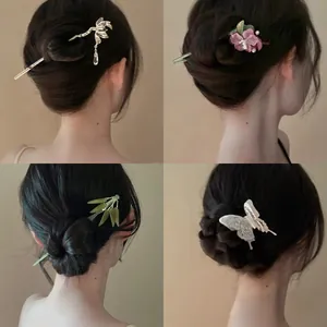 Four styles of elegant Chinese hairpins shown on hair bun for traditional Hanfu styling
