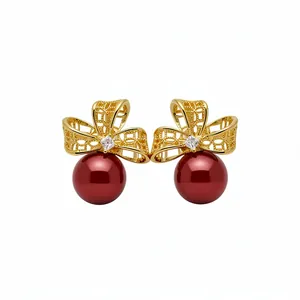 Elegant 18k gold plated bow-knot stud earrings with deep red pearls and zircon accents