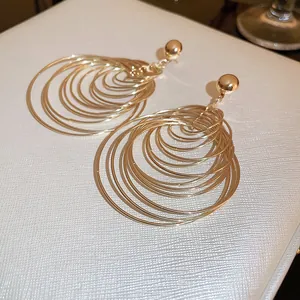 Elegant gold multi-layered concentric circle hoop earrings for a stylish statement look