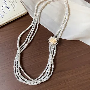 Elegant French multi-layer pearl necklace with rhinestone camellia flower charm