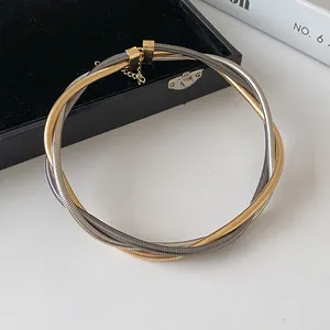 Elegant multi-layer twisted metal choker necklace in gold and silver finish for women