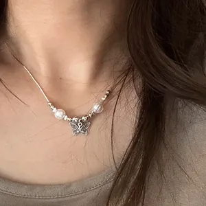 Elegant minimalist silver butterfly pendant necklace with white pearls for women