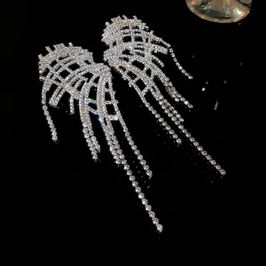 Silver needle rhinestone earrings with irregular tassel design for a chic party look