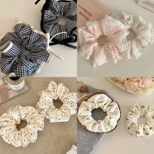 Detailed collage of floral and polka dot hair scrunchies with lace trim and satin finish